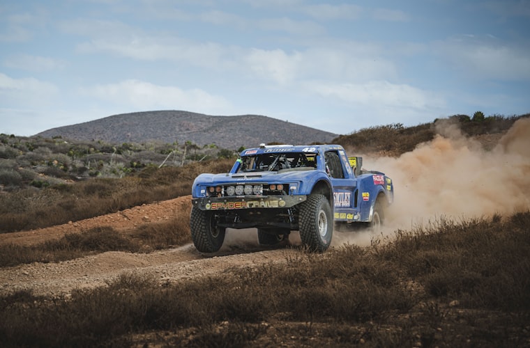 Off-road truck tackling rugged terrain at King of the Hammers